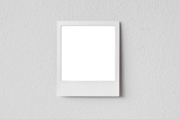 istock Photograph on gray wall, blank empty picture frame mock-up 2157246848