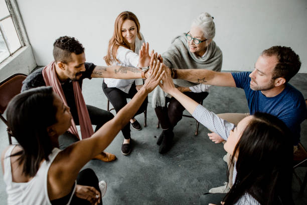 istock Group of diverse team joining hand in the middle 2157247429