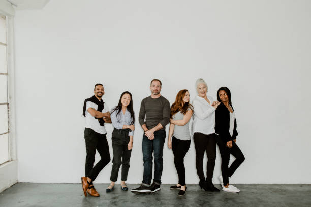 Group of cheerful diverse people in a white room