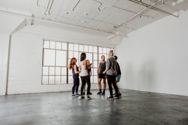 istock Healthy people grouping in a circle in a sport studio 2157248366