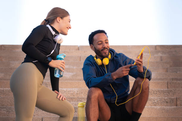 istock Young athletes, who use apps on their phone to track their workout routine and drink water. 2157248434
