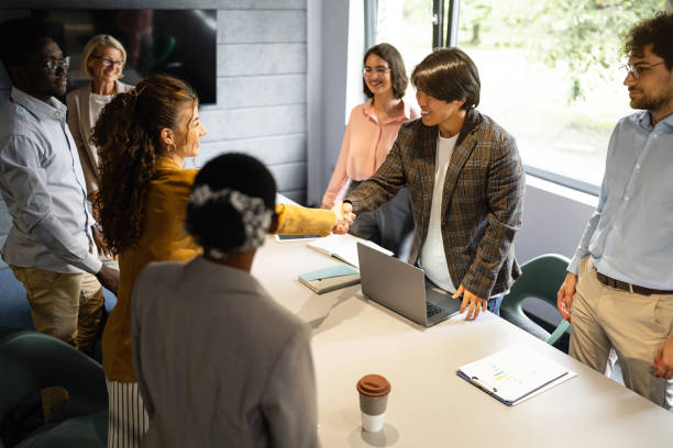 istock Multiracial businesspeople handshake during a business meeting 2157250108