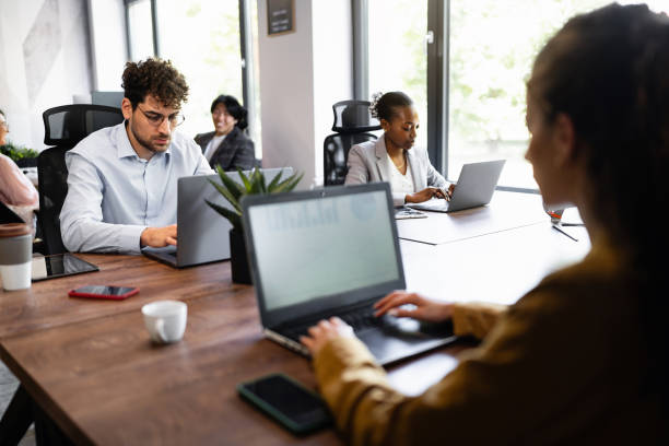 istock Multiracial coworkers working on laptop at the office 2157250608