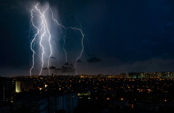 istock natural phenomenon, multiple lightning over the city, high-voltage discharge 2157250914