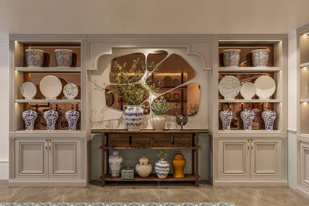 A traditional style ceramic dishes neatly arranged on wall-mounted shelves in an antic piece shop