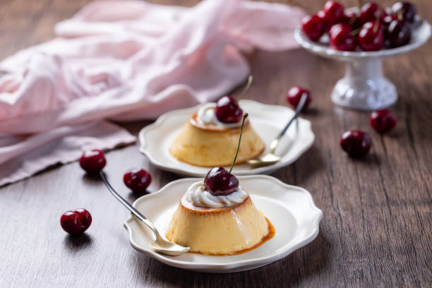 Flan with whipped cream and cherry