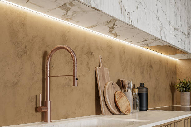 istock A kitchen sink with a copper faucet with golden accents. 2157253230