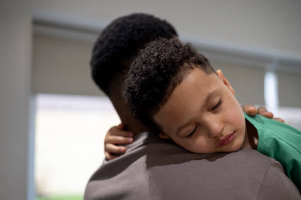 istock Sleepy Boy Being Carried by Father 2157253234