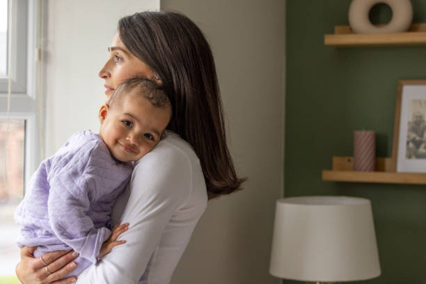 istock Mother and Baby Embracing at Home 2157253329