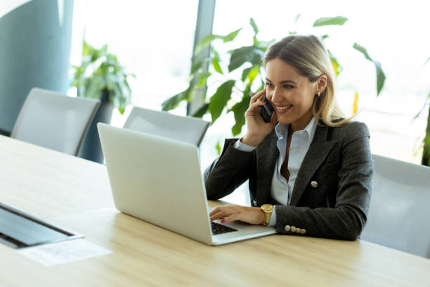 istock Bright morning business call in modern office setting with greenery 2157253862