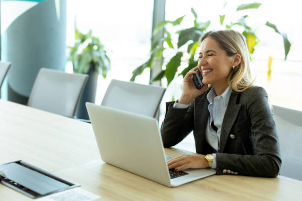 istock Bright morning business call in modern office setting with greenery 2157253894