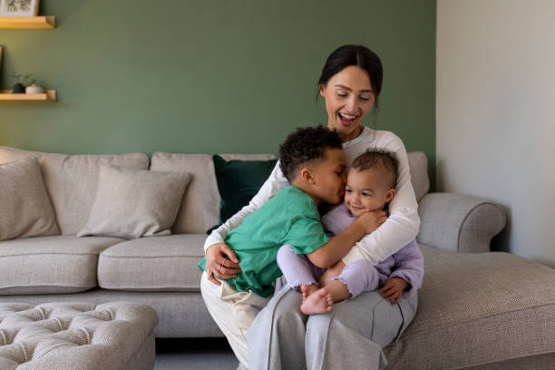 istock Cute Siblings at Home with Mother 2157253926