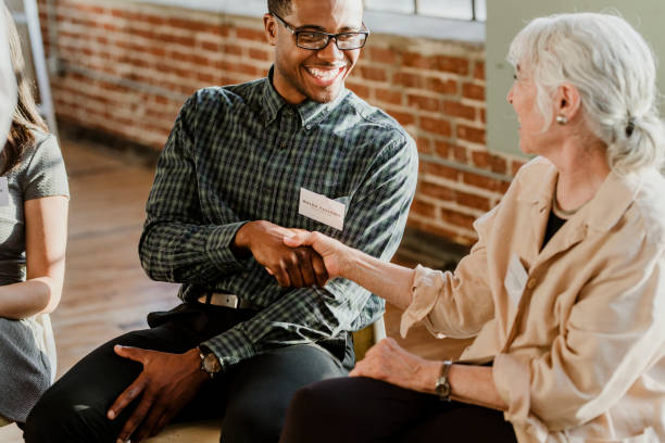 istock Man handshake with a senior woman 2157254182