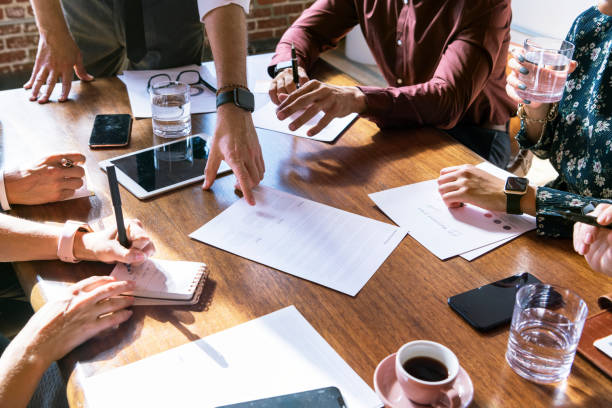 istock Businesspeople brainstorming in a meeting 2157254211