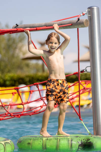 istock Cute child, boy in water park, having fun summertime 2157255049