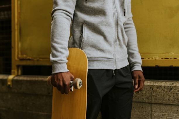 istock Man with wooden skateboard in skate park 2157255147