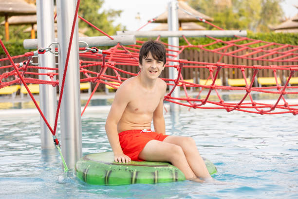 istock Cute child, boy in water park, having fun summertime 2157255259
