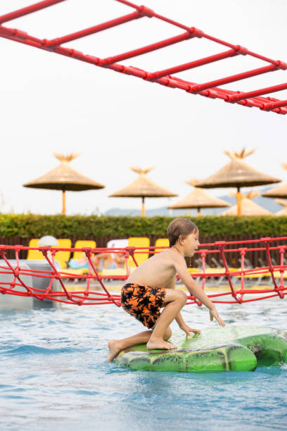 istock Cute child, boy in water park, having fun summertime 2157255326