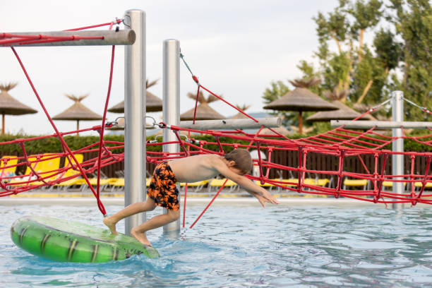 istock Cute child, boy in water park, having fun summertime 2157255506