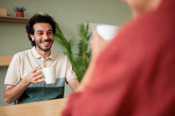istock Two roommates talking and drinking coffee at home 2157255591