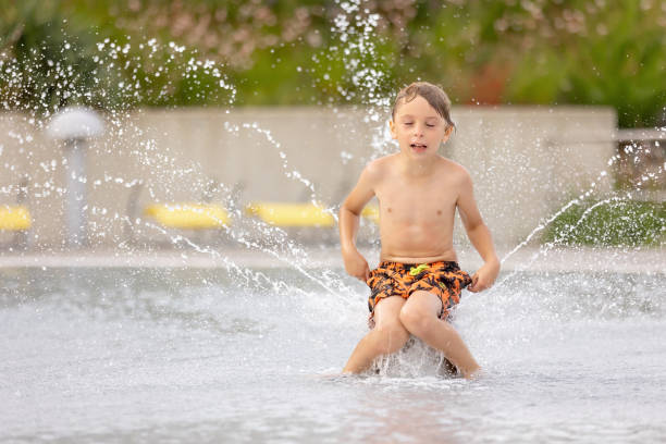 istock Cute child, boy in water park, having fun summertime 2157255603