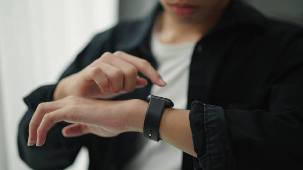 istock Teenager talking with voice assistant on smartwatch. 2157255657
