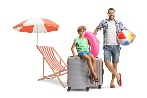 istock Father and son with a suitcase on a summer holiday 2157256193