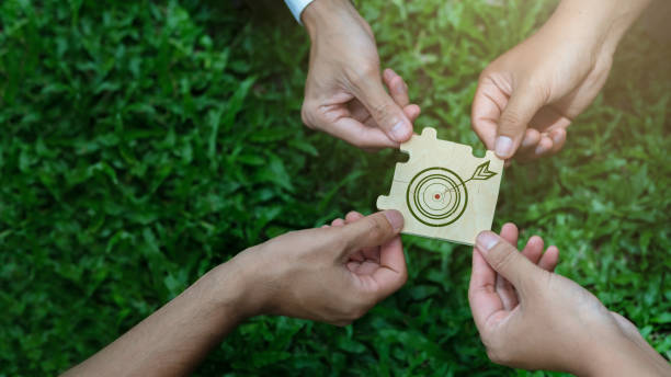 world environment day Global teamwork goals for a sustainable environment Businessmen join forces to puzzle together ideas to help save the world.