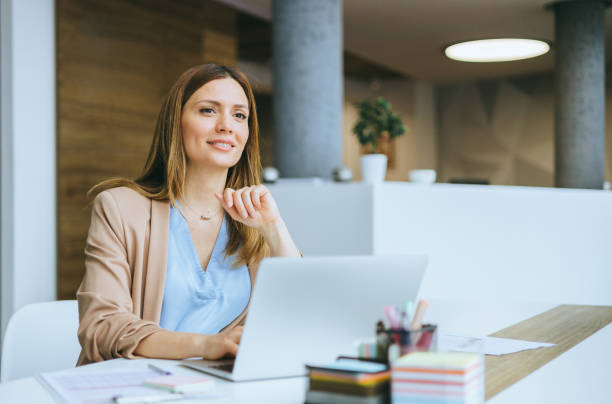 istock Businesswoman working on her laptop 2157262216