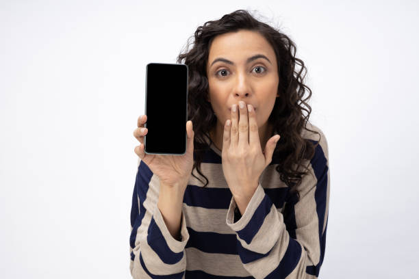 istock Young woman showing device screen isolate white background stock photo 2157265136