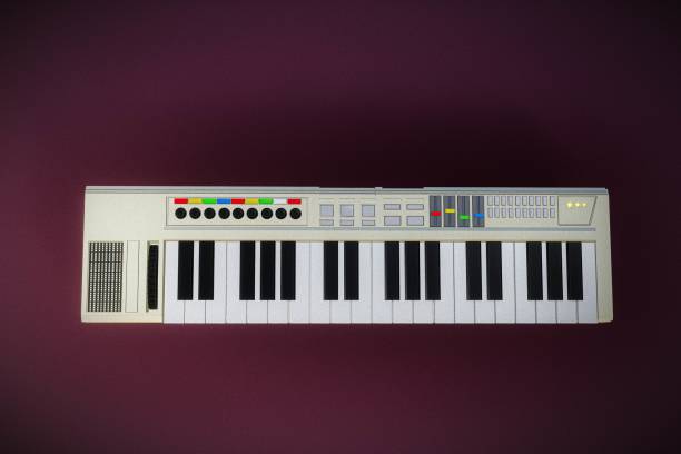 istock musical keyboard isolated on purple background 2157265674
