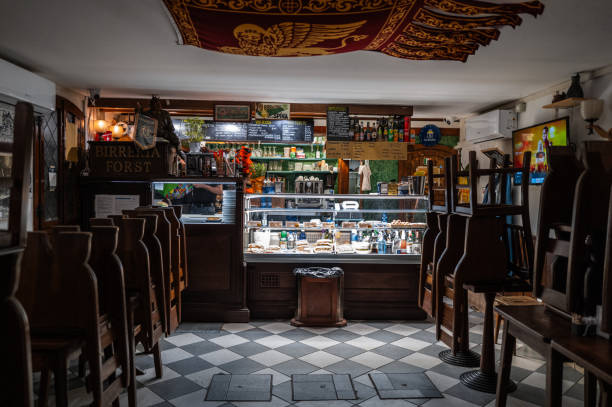 Venice, Italy - June 01, 2024: The interior and decoration of an empty Italian coffee and lunch bar before opening, with the chairs still on the table