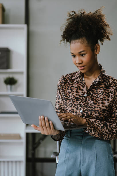 istock Businesswomen hand working with tablet and laptop computer with documents on office desk in modern office. 2157266269