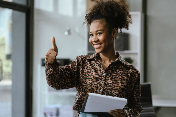 istock Happy young businesswoman presenting or pointing, happy working. 2157266284