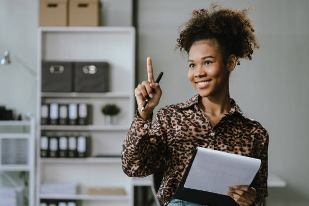 istock Happy young businesswoman presenting or pointing, happy working. 2157266288