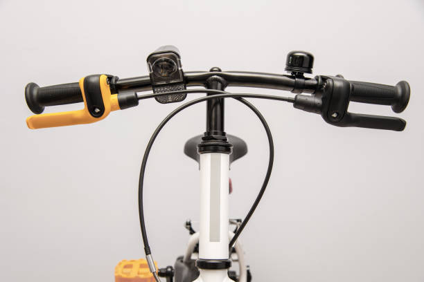 istock Bicycle handlebar close-up, with brake levers and bell. 2157267184