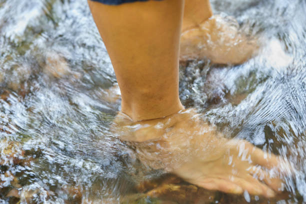 Woman feet soaking in water
