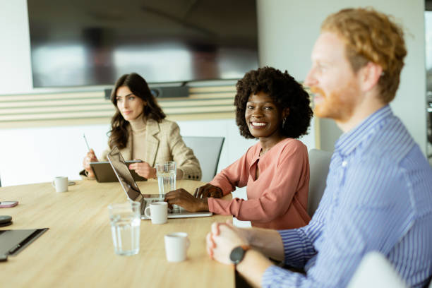 istock Dynamic team collaboration in a modern office setting on a sunny afternoon 2157271019