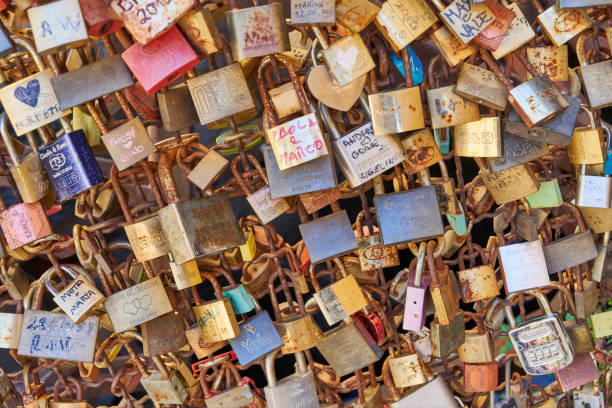 Valeggio sul Mincio, Italy - June 01, 2024: love padlocks on a bridge in Borghetto, a small medieval village in Veneto region.