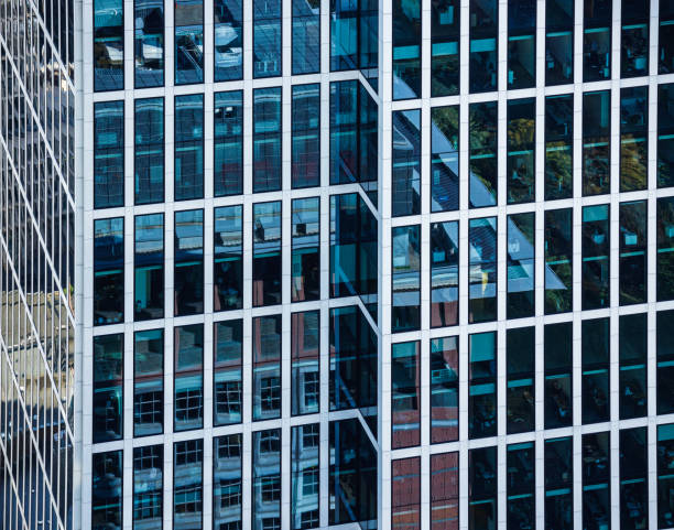 Office building exterior, blue glass and steel facade, abstract backgrounds, full frame