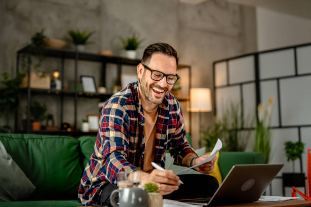 istock One men sitting and working from home, making a video call on a laptop, using technology concept 2157278068