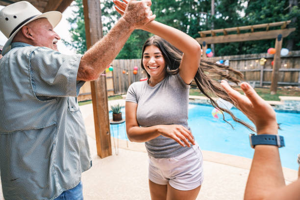 istock Multi generation Latino family dancing at the backyard party 2157280157