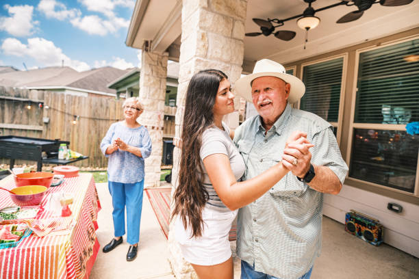 istock Multi generation Latino family dancing at the backyard party 2157280205