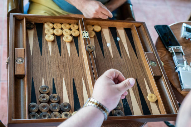 istock two men hands are playing backgammon high point of view horizontal still 2157283132