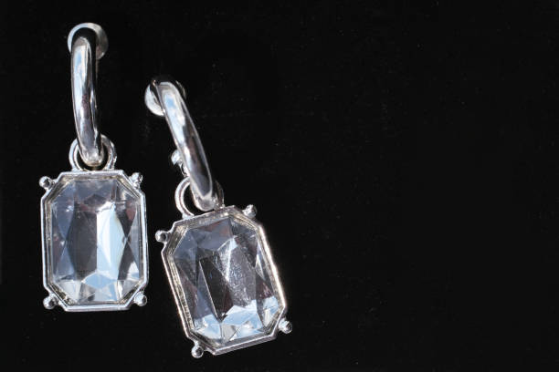 Diamond earrings. Luxury earrings on black background
