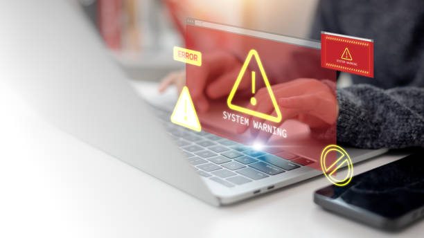 istock Cyber security concept. Women using a computer receive a system hacked alert due to a cyber attack on the network. Emphasizes data protection against internet viruses, cyber security, and cybercrime. 2157285663