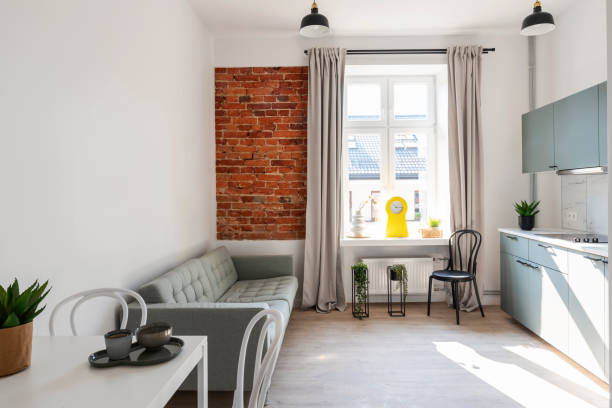 istock Studio apartment with kitchen, table, chair and design indoors architecture. Interior decor. 2157285709