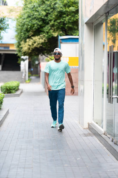 istock Young Man Walking Down City Street 2157287044