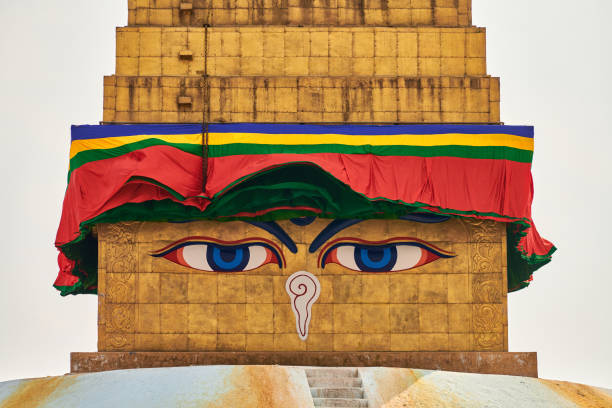 Boudhanath stupa in Kathmandu, Nepal decorated Buddha wisdom eyes and prayer flags, most popular tourist attractions in Kathmandu reflecting harmonious blend of spirituality and tourism