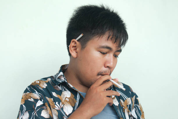 istock Handsome cool man with Cigarette, going to smoke, isolated on white background 2157291105